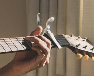 Capo Clamped on Guitar Capo Clamped on Guitar